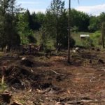 Firefighters spent over three hours, digging and deploying nearly 5,000 gallons of water, to snuff a fire that started with a controlled outdoor burn. 