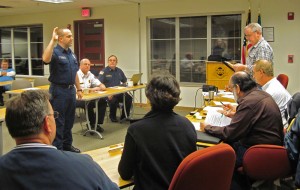 Matt Thompson takes his oath in front of the Board of Fire Commissioners
